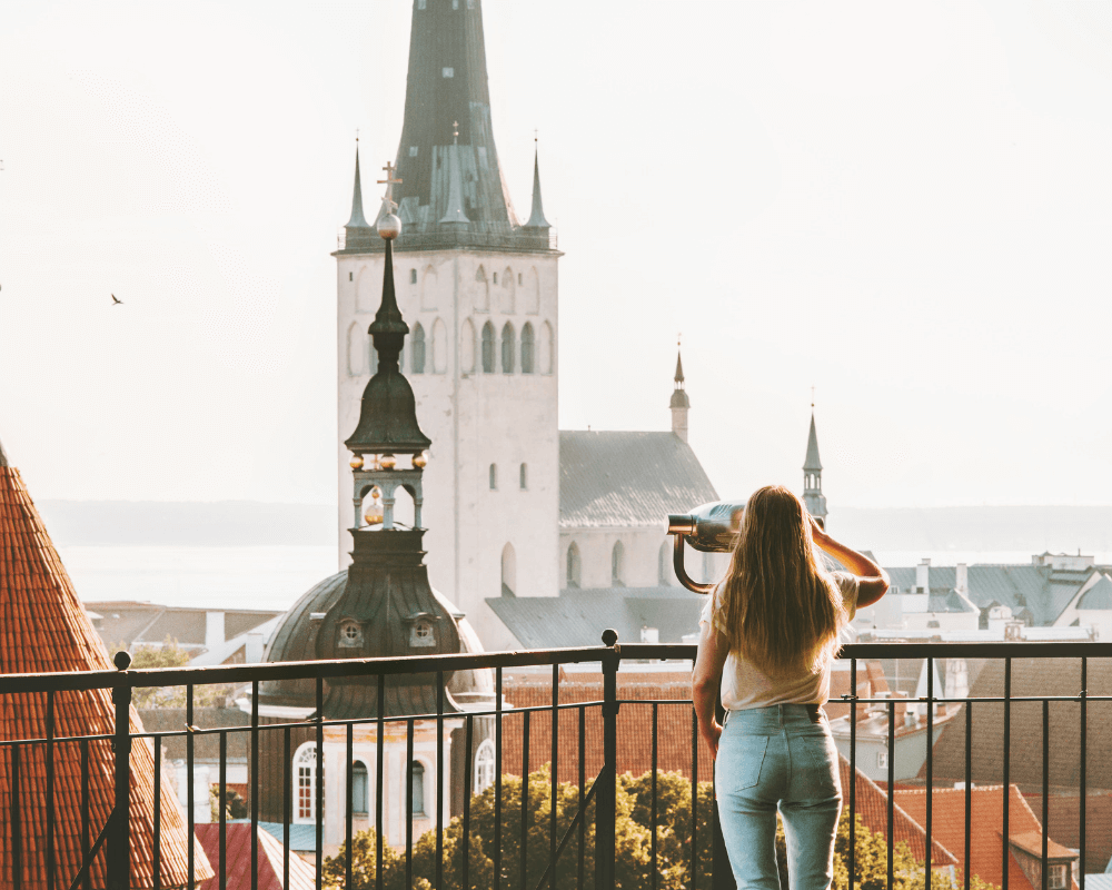 A woman looking across the cityscape of Tallinn