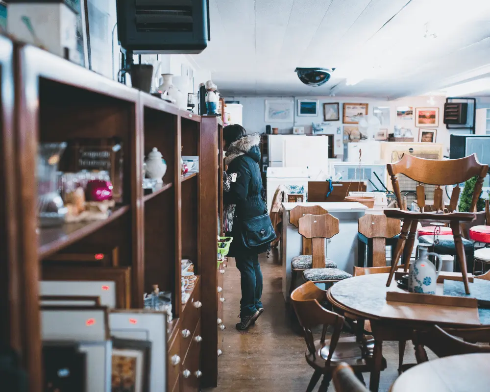 A woman shopping at a second hand furniture store