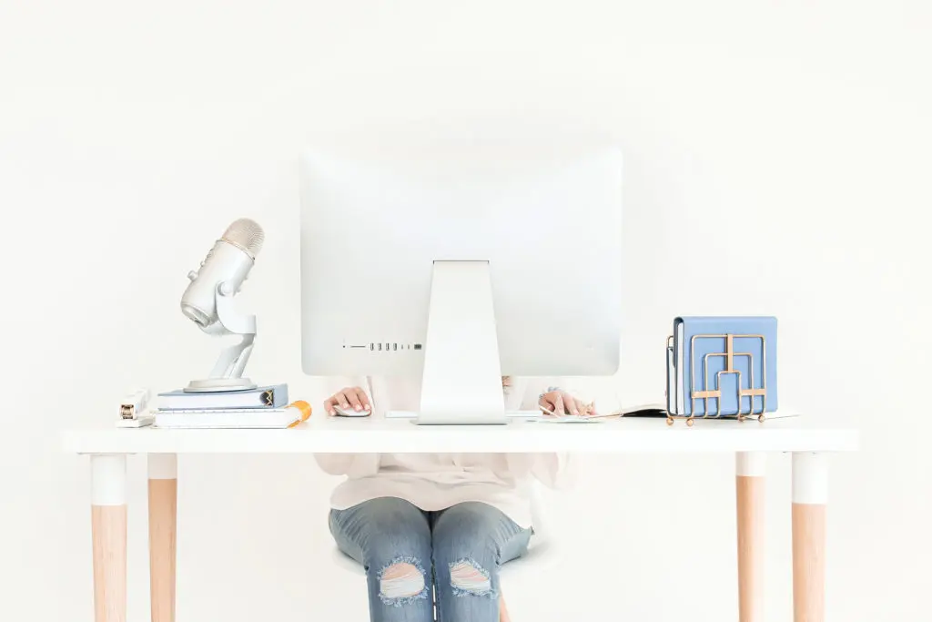 A virtual assistant at a computer