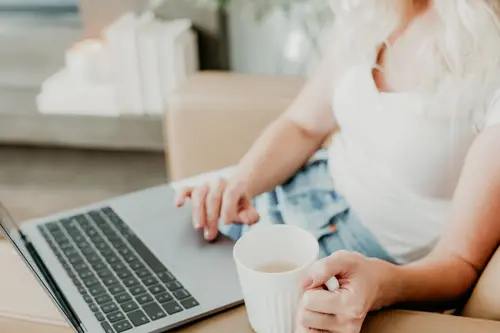 woman with laptop and coffee