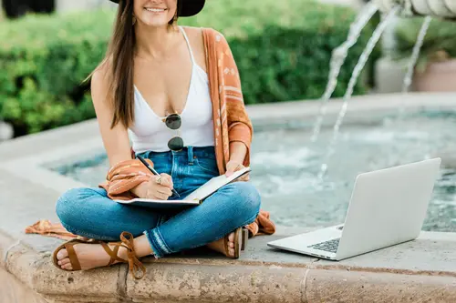 working online next to fountain