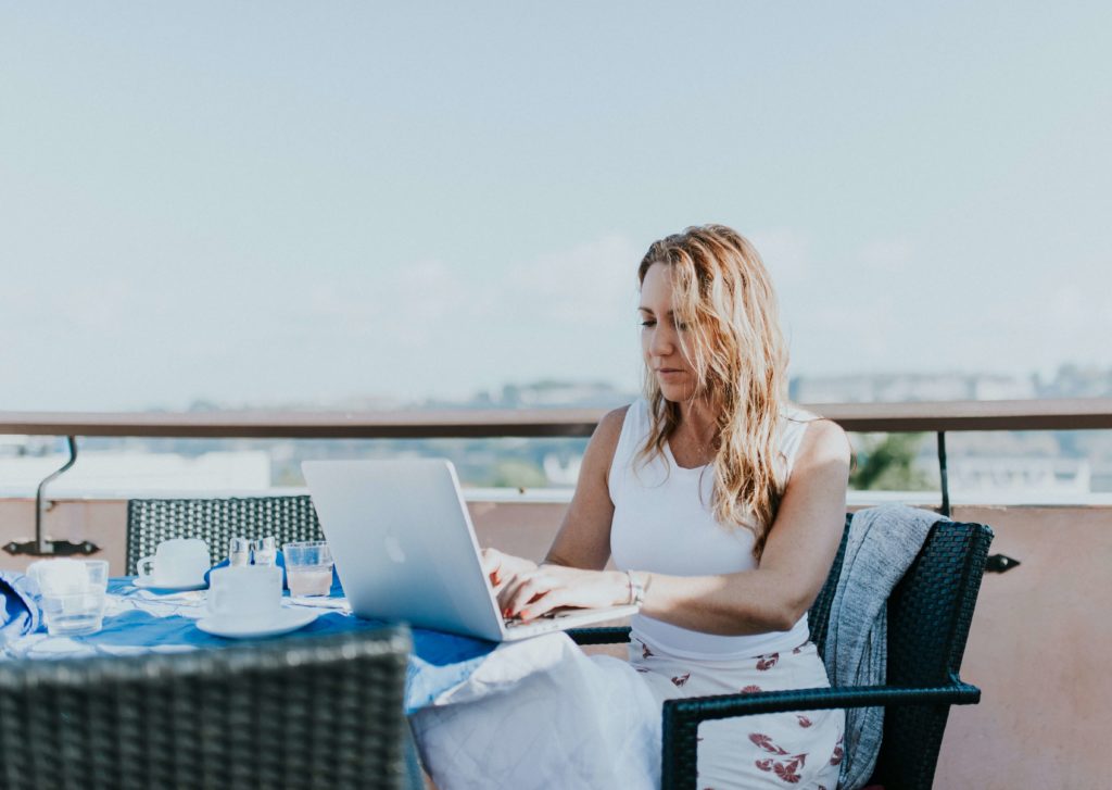 virtual assistant working by the beach