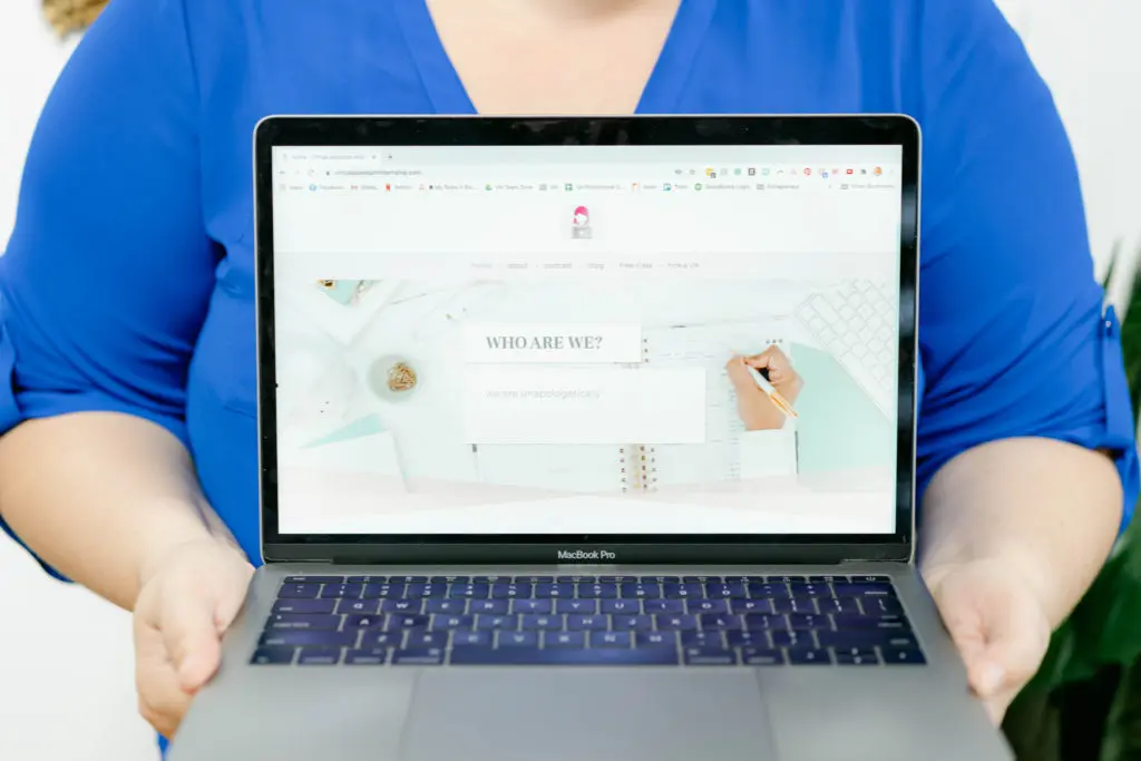 Esther holding laptop