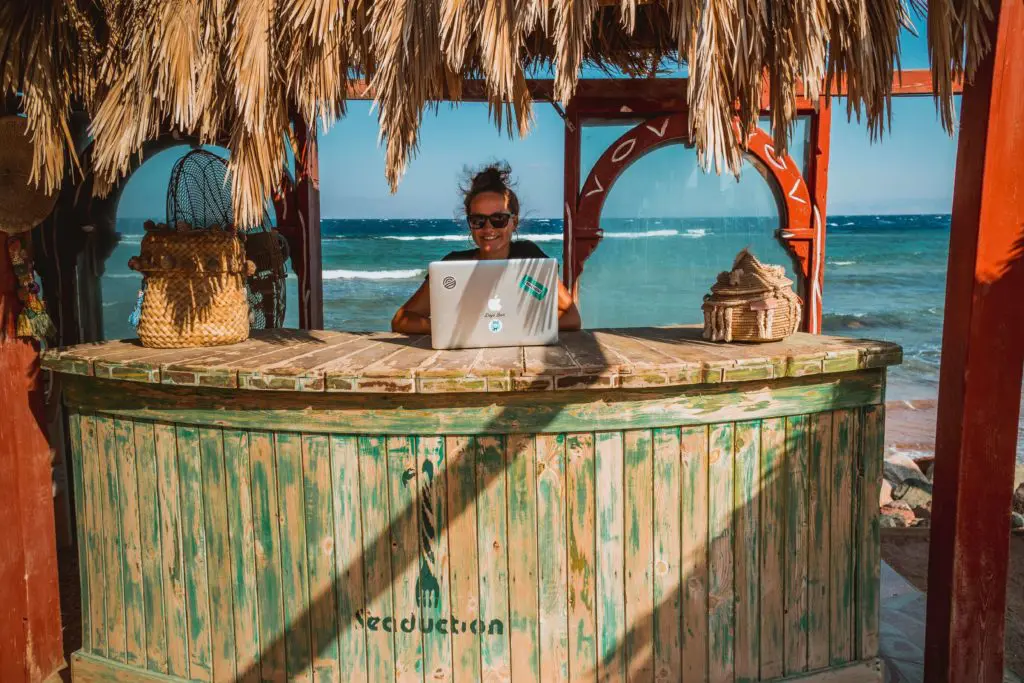 virtual assistant working at the beach