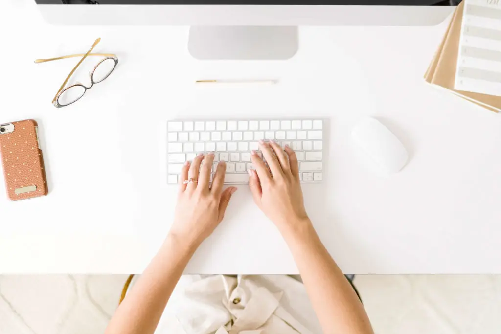 virtual assistant typing on computer