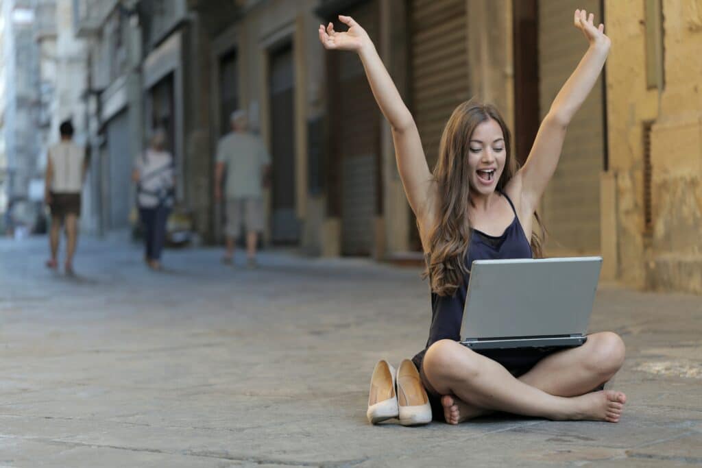 woman successful and happy with laptop