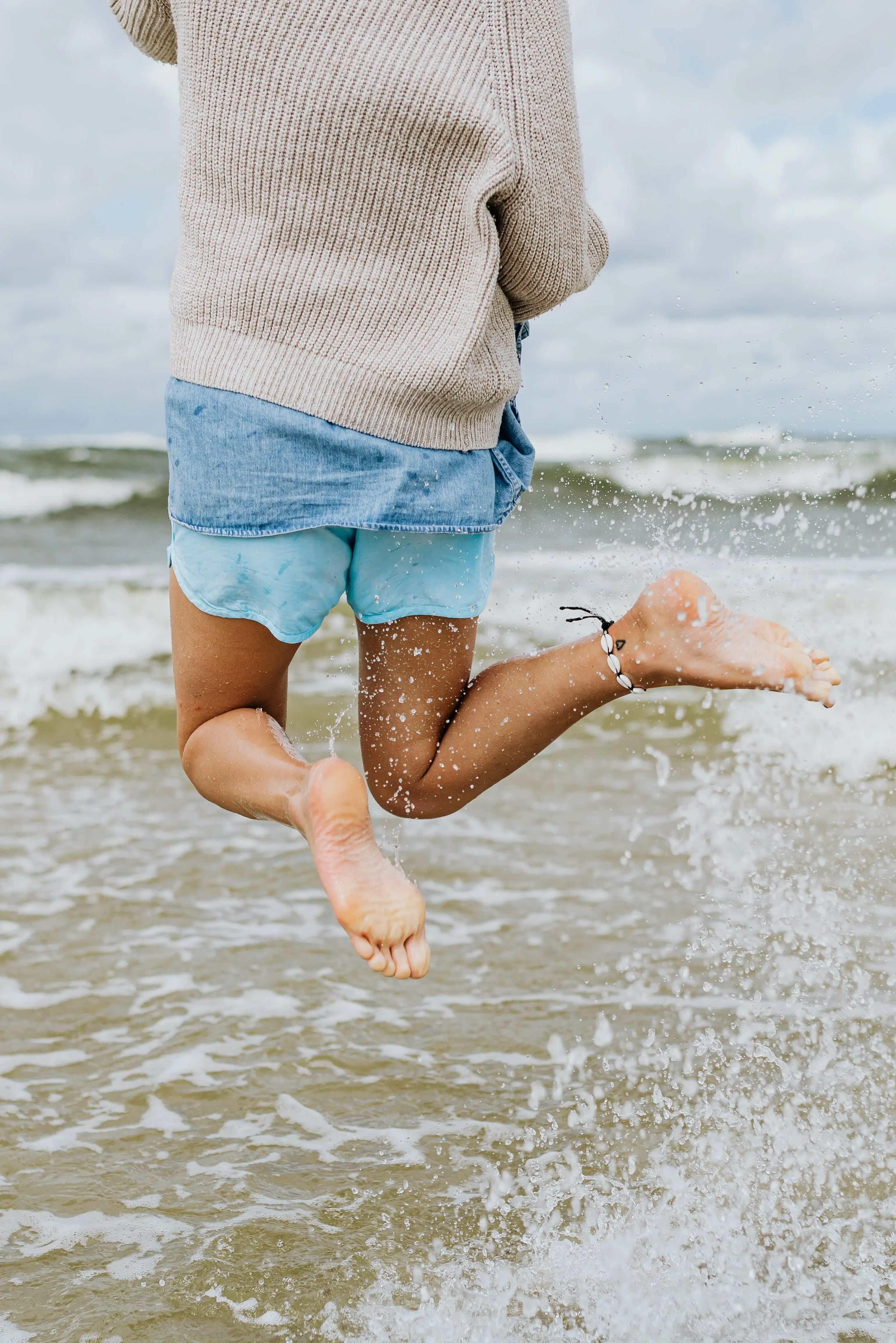 woman jumping excited into new adventure